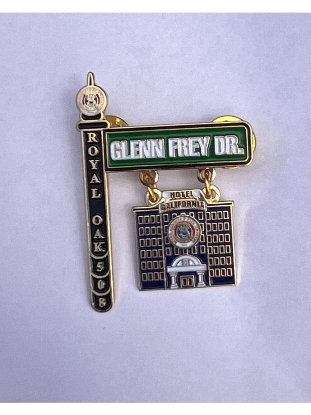 Vintage Royal Oak 508 Glenn Frey Dr Hotel California Enamel Dangle Lapel Pin NAP